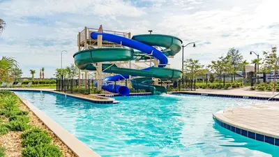 a water slide in a pool at a resort at 4805 Brier Rose in Kissimmee