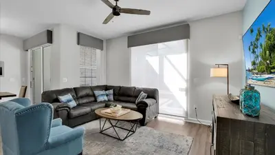 a living room with a couch and a table at 3070 Gatsby in Kissimmee