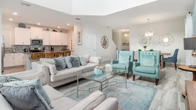 a living room with a couch and chairs and a table at 4797 Kings Castle in Kissimmee