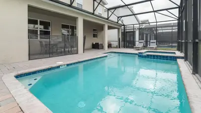 a large swimming pool in a building with a building at 4543 Narrative in Kissimmee