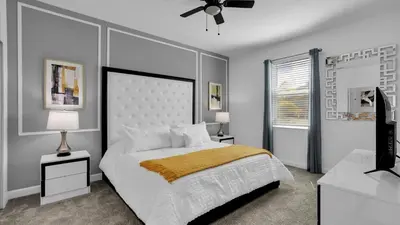 a bedroom with a bed and a television in it at 2718 Oxymoron in Kissimmee