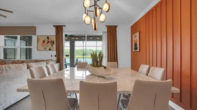 a dining room with a table and chairs at 4169 Paragraph in Kissimmee