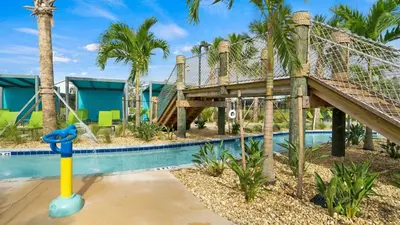 a resort with a slide and a pool at 4361 Quote in Kissimmee