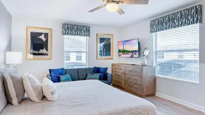 a bedroom with a bed and a couch at 4724 Sleepy Hollow in Kissimmee