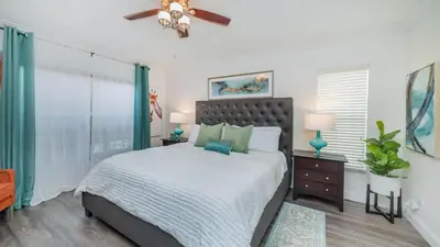 a bedroom with a bed and a ceiling fan at 2787 Lido Key in Kissimmee