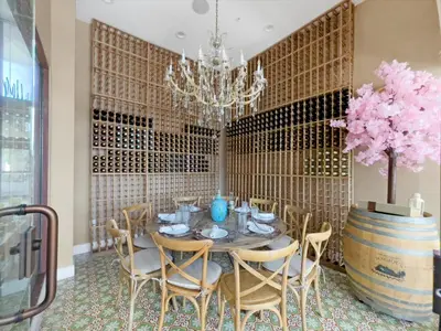 a dining room with a table and chairs and a chandelier at 7646 Recife in Kissimmee