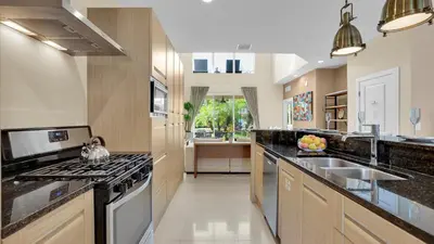 a large kitchen with a sink and a stove at 7646 Recife in Kissimmee