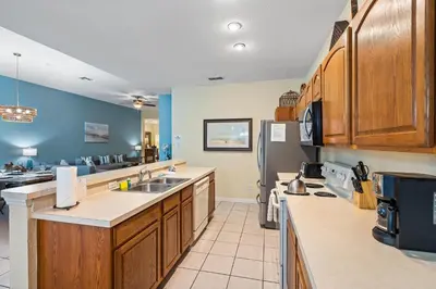 a kitchen with wooden cabinets and a counter top at 7719 Comrow in Kissimmee
