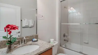 a bathroom with a sink and a shower at 4741 Kings Castle C in Kissimmee