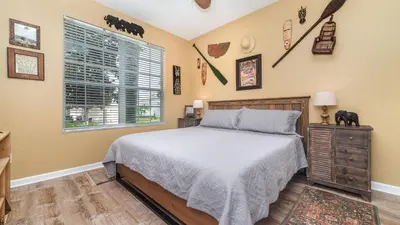 a bedroom with a bed and a window at 7740 Comrow in Kissimmee