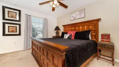 a bedroom with a bed and a ceiling fan at 2696 Manesty in Kissimmee