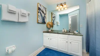 a bathroom with a sink and a mirror at 2537 Maneshaw in Kissimmee