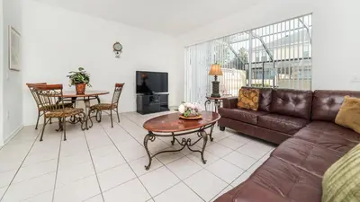 a living room with a couch and a table at 7652 Otterspool in Kissimmee