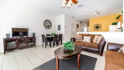 a living room with a couch and a table at 7678 Otterspool in Kissimmee