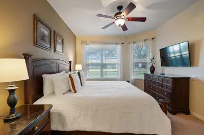 a bedroom with a bed and a ceiling fan at 2605 Pawnall in Kissimmee