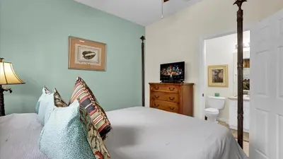 a bedroom with a bed and a television in it at 7653 Sir Kaufmann in Kissimmee