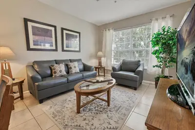 a living room with a couch and a table at 8107 Coconut Palm #305 in Kissimmee