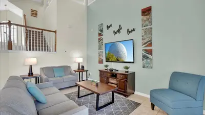 a living room with a couch and a table at 8176 Fan Palm in Kissimmee