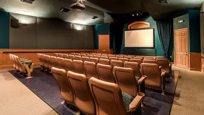 an empty lecture room with chairs and a screen at 8114 Princess Palm in Kissimmee
