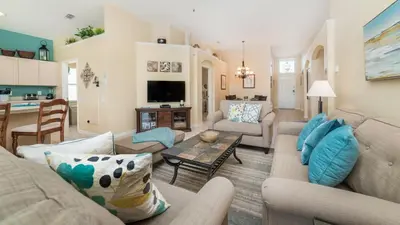 a living room with a couch and a table at 8137 Sun Palm in Kissimmee