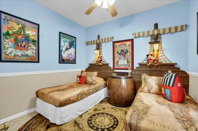 a room with two beds and a couch in it at 2302 Silver Palm # 103 in Kissimmee