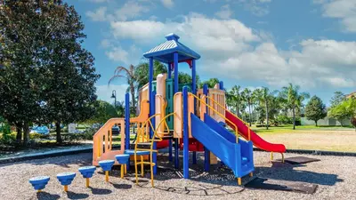 a playground with a slide in a park at 8946 Cuban Palm in Kissimmee