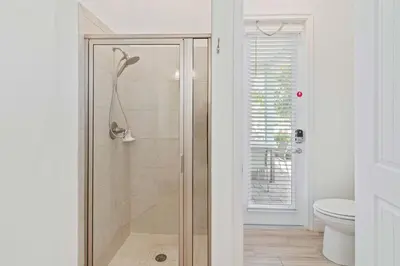 a shower with a glass door in a bathroom at 8000 Lost Shaker Lane in Orlando