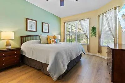 a bedroom with a bed and a large window at 2638 Dinville in Orlando
