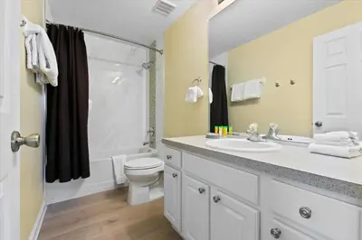a bathroom with a sink and a toilet and a shower at 2638 Dinville in Orlando