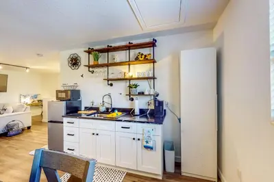 a kitchen with a sink and a refrigerator at Dog-Friendly Apt with Fenced Yard in Winter Park in Orlando