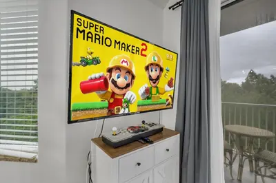 a tv screen with a mario maker game on it at 2BR condo minutes to Disney Springs in Orlando