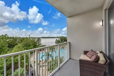 a balcony with a view of a body of water at 2BR condo minutes to Disney Springs in Orlando