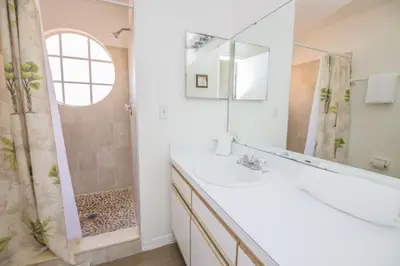 a bathroom with a sink and a shower at Sweetwater Club 3 Bedroom Condo Resort Pool 9 Miles to Disney in Kissimmee