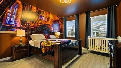 a bedroom with a bed and a stained glass window at Opulent Retreat, Pool & Lake View, Near Parks in Kissimmee