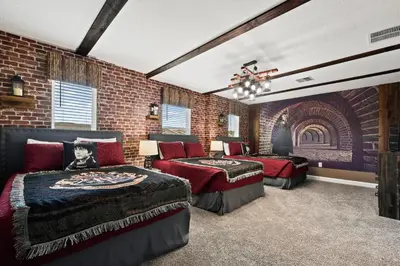 a bedroom with two beds and a brick wall at Lakeview Villa Near Disney with Pool & Resort in Kissimmee