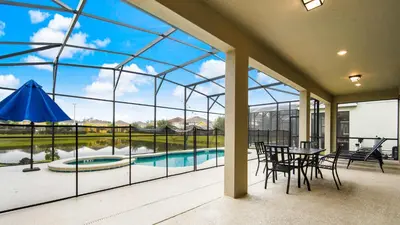a glass house with a pool and tables and chairs at Veranda Palms Lakeview 6br Villa Pool Spa, Disney in Kissimmee