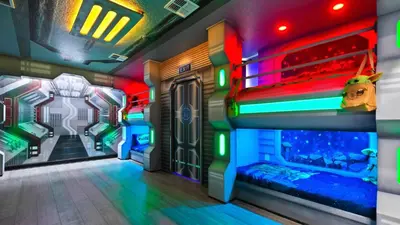 a room with two bunk beds with neon lights at Star Wars Disney Themed 10BR Villa Pool/Spa/Game in Kissimmee