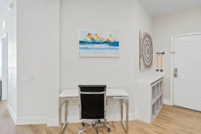 a white office with a desk and a chair at The Epic London Vista Cay Orlando Next to the club in Orlando