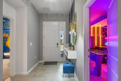 a hallway with a pink and purple hallway at Game Room 12BR Kids World Pool Spa Near Disney in Kissimmee