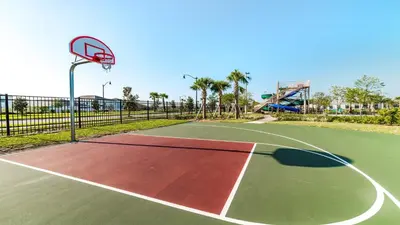 a basketball court with a hoop in a park at Storey Lake 10BR Home Pool/SPA/Game Room,GreenView in Kissimmee