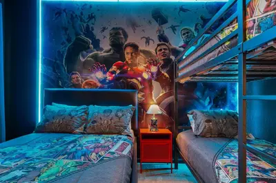 a bedroom with a superhero mural on the wall at Mario 12BR Villa w/ Private Green View Pool in Kissimmee