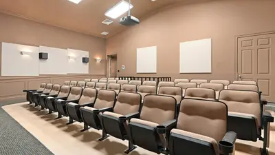 an empty lecture room with rows of chairs at Firework view 6BR Home Pool/Spa/Game Near Disney! in Orlando