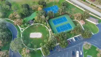 an aerial view of a house with a tennis court at Highland View 6BR Villa Private Pool Near Disney in Orlando