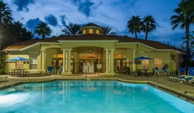 a large swimming pool in front of a house at Emerald Escape in Kissimmee