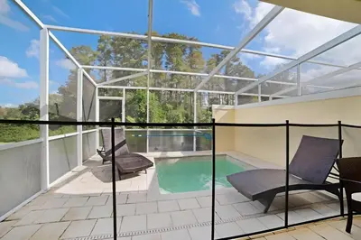 an image of a house with a swimming pool at 3 bedrooms pool home Retreat Close to Disney in Orlando