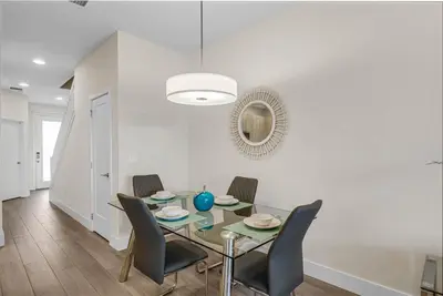 a dining room with a glass table and chairs at 3 bedrooms pool home Hidden Forest Resort Amenities in Orlando