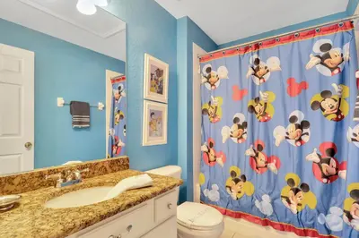 a bathroom with a sink and a shower curtain at WH7642SKC 3 beds pool home Gated resort in Orlando