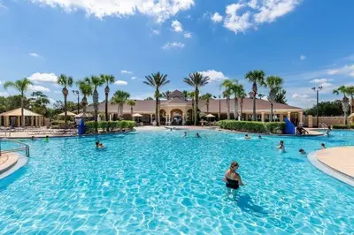 a group of people in a swimming pool at a resort at WH7642SKC 3 beds pool home Gated resort in Orlando