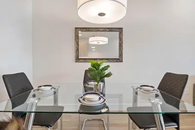 a dining room with a glass table and chairs at 3 bedrooms pool home Hidden Forest Resort Amenities in Orlando