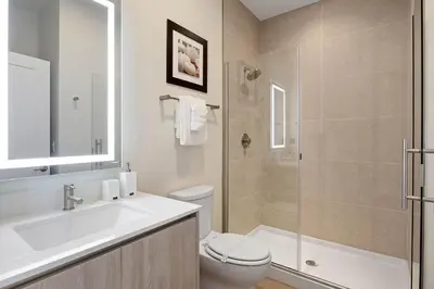 a bathroom with a sink and a toilet and a shower at 3 bedrooms pool home Hidden Forest Resort Amenities in Orlando
